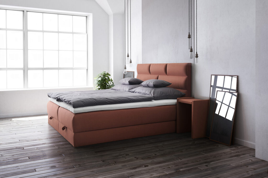 Boxspringbett neben grossem Fenster